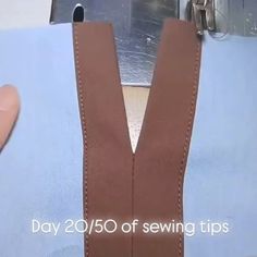 a person is holding up a piece of fabric with the words, day 205 of sewing tips