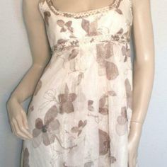 Beautiful Shimmery Ivory Floral Braided Dress Empire Waist New With Tags Cream A-line Silk Dress, Spring Beige Empire Waist Dress, Beige Empire Waist Dress For Spring, Knee-length Cream Dress For Casual Wear, Casual Cream Midi Dress, Feminine Beige Empire Waist Dress, Cream Flowy Dress For Daywear, Chic Beige Empire Waist Dress, Cream Silk Sleeveless Midi Dress