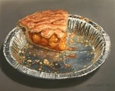 a piece of pie sitting on top of a metal pan covered in caramel sauce