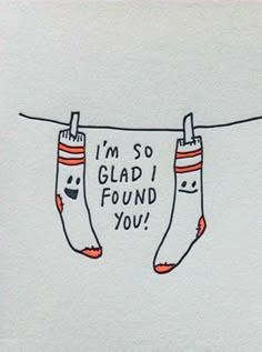 two socks hanging on clothesline with the words i'm so glad found you