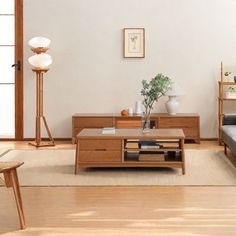 a living room filled with furniture and a wooden coffee table on top of a hard wood floor