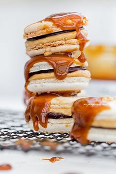 a stack of pancakes covered in caramel sauce