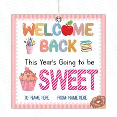 a welcome back sign with a cupcake and an apple on it, hanging from a hook