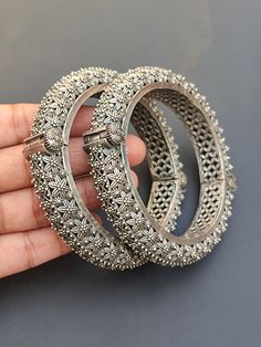 You will receive Set of  2 Pcs Floral Motif Oxidized Silver Bangle Bracelet (kada) Openable Handcrafted Vintage Style Antique Look Indian Traditional Jewelry Metal: Brass Bangle Width : 13 mm inner diameter: 2.3" Approx.   Thank you very much for visiting ! Any questions, please feel free to contact us. Discount for bulk provide. Openable Silver Bangle Jewelry, Silver Openable Bangle Jewelry, Silver Openable Bracelets As A Gift, Silver Openable Bracelets For Gift, Silver Openable Bracelet For Gift, Silver Openable Bangle, Traditional Metal Bracelets For Celebration, Festive Silver Bracelet With Intricate Design, Silver Bracelets With Tilla