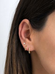 "Dainty and beautiful, these tiny studs are adorned with three bright prong-set cubic zirconia gemstones. An everyday staple piece, perfect for wearing in a first, second or third earhole or on a cartilage piercing for a dainty addition to your look. * Sold as a PAIR * D E T A I L S * ∙ Material: .925 Sterling Silver or 18K Gold Plated over .925 Sterling Silver ∙ Stone: White Zirconia ∙ Dimensions: 4mm ∙ Hypoallergenic & nickel-free * P A C K A G I N G * ∙ All jewelry is sent out beautifully Three Ears Pierced, 3 Ear Piercings Gold, Ear Piercing Inspo Minimalist, Minimalist Hoop Piercings With Prong Setting, Everyday Hoop Piercings With Prong Setting, Minimalist Tarnish Resistant Cubic Zirconia Hoop Earrings, Minimalist Small Hoop Cartilage Earrings In Cubic Zirconia, Minimalist Hoop Earrings With Prong Setting For Everyday, Minimalist Everyday Hoop Earrings With Prong Setting