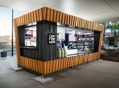 a small building made out of shipping containers