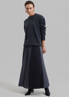 Color: Charcoal Midweight woven fabric Regular fit Maxi length Pleated detailing throughout Color block detailing Partially elasticated waist Side seam zip closure Partially lined 65% Tencel 28% Rayon 5% Wool 2% Elastane Dry Clean Imported Pleated Long Skirt Outfit, Long Pleated Skirt Outfit, Pleated Maxi Skirt Outfit, Skirt Boots Outfit, Pleated Skirt Outfit Ideas, Wool Skirt Outfit, Long Grey Skirt, Pleated Skirt Outfit, Ribbed Skirt