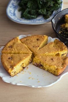 a cake on a plate with one slice cut out