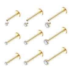 six pairs of gold nose piercings with crystal stones