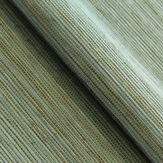 a close up view of the fabric on top of a table cloth, with small stripes