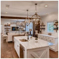 a large kitchen with an island in the middle and lots of counter space around it