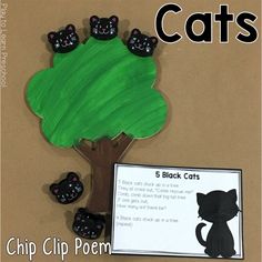 a paper plate with black cats on it next to a tree and a sign that says, 5 black cats