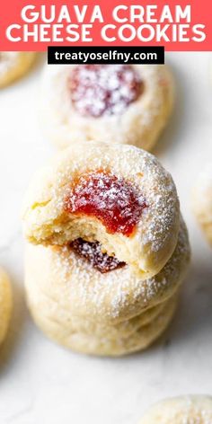 some sugary cookies with jam on them and the words glauva cream cheese cookies