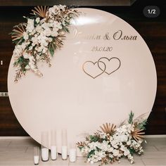 the wedding sign is decorated with flowers and candles