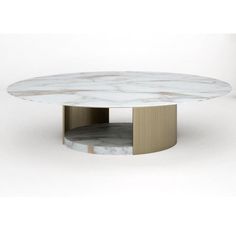 a white marble coffee table with gold trim around the base and round design on top