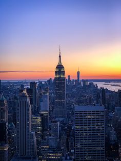 the empire building in new york city at sunset