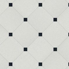 a white and black tiled wall with squares