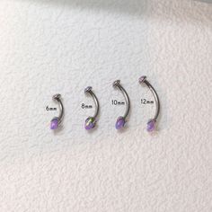 Eyebrow jewelry Purple opal eyebrow piercing jewelry 16G G23 curved barbell eyebrow piercing opal jewelry 💎Size: 16G (1.2mm); Length: (6mm/8mm/10mm/12mm). 💎Hypoallergenic material: grade 23 solid titanium, 100% hypoallergenic and nickel-free. How to care for your new jewelry *If cleaning is required, be sure to use warm water and mild soap. Never use alcohol or any chemicals as they may cause discoloration or other adverse effects on the jewelry. Be sure to dry yourself and the jewelry thoroug Eyebrow Piercing Jewelry, Eyebrow Jewelry, Purple Opal, Jewelry Purple, Eyebrow Piercing, New Jewelry, Zipper Bag, Body Jewellery, Opal Jewelry