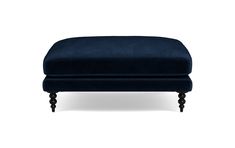 the footstool is upholstered with dark wood legs and an elegant blue velvet cover