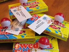 several candy candies are stacked on top of each other with tags attached to them