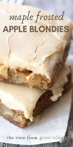 two pieces of apple blondies sitting on top of each other with frosted toppings