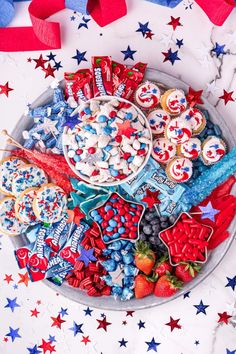 patriotic dessert platter with red, white and blue treats on it for fourth of july