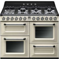 a white stove top oven with two burners and one oven on the right side