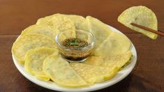 a plate with chips and dipping sauce on it