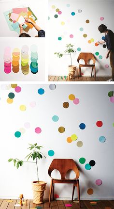 the wall is decorated with multicolored polka dot decals and a wooden chair