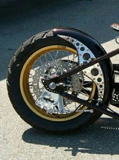 a black and gold motorcycle parked on the street