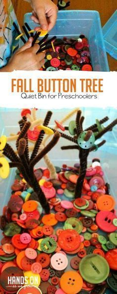 a plastic container filled with buttons and some hands on the button tree that is made out of