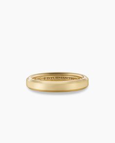 a yellow gold wedding ring with the word'dyromann'engraved on it