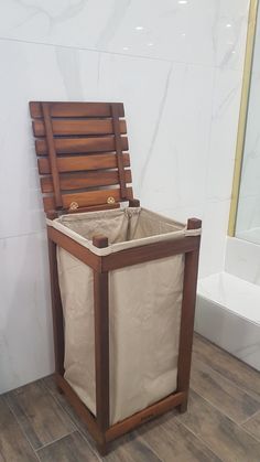 a wooden chair sitting on top of a tiled floor