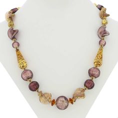 This gorgeous Murano necklace can be immediately attributed to the hands of Murano glass masters for its artistic elegance, deep colors that will never fade, and exquisite workmanship. The Venetian necklace showcases the best of Murano glass-making with the combination of 24K gold leaf, elaborate bead shapes, beautiful color pattern, and unique beads adorned by raised decorations that use 24 karat gold to create truly royal impression. This wearable work of Venetian glass art was entirely hand-c Murano Necklace, Gold Murano Glass Single Strand Necklace, Elegant Multicolor Murano Glass Jewelry, Unique Multicolor Murano Glass Necklaces, Bead Shapes, Luxury Handmade Murano Glass Necklace, Elegant Gold Murano Glass Necklace, Murano Glass Necklaces, Glass Making