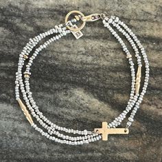 A Hammered, 14kt Gold-Filled Cross Mingles With Three Strands Of Sterling Silver Seed Beads, 14kt Gold-Filled Beads And 14kt Gold Vermeil Daisy Beads. 14kt Gold-Filled Lobster Clasp. Handcrafted In Usa. Exclusive. 7.5" Long. New With Tags. Daisy Beads, Sundance Jewelry, Cross Bracelet, 14kt Gold, Womens Jewelry Bracelets, Gold Vermeil, Lobster Clasp, Seed Beads, Gold Filled