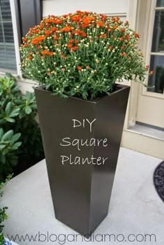 a planter that has flowers in it with the words diy square planter written on it