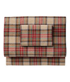 the plaid sheet set is shown in red, beige and green