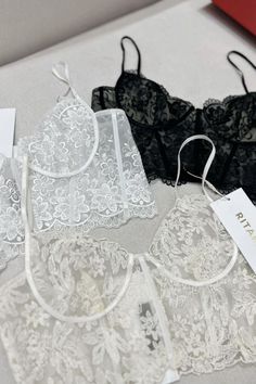 This bralette offers a stylish and supportive fit. Crafted with ultra-soft, stretchy fabric and a delicate lace trim, this bralette ensures maximum comfort. It features a front clasp closure and adjustable straps for a snug and secure fit that lasts all day. Elegant Underwire Crop Top Bra Friendly, Lace Crop Top With Adjustable Spaghetti Straps, Lace Camisole Bra With Delicate Straps, White Underwire Crop Top With Built-in Bra, Lace Underbust Bra With Lace Closure, Underbust Bra With Lace Closure, Underbust Lace Bra, Underwire Crop Top With Adjustable Straps, Lace Camisole Bra With Lace Trim