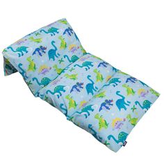 a child's sleeping bag with blue dinosaurs on it and green dinos all over