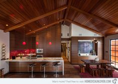 the interior of a modern kitchen with wooden ceilings and ceilinging is featured in this article