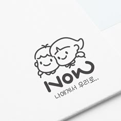 the logo for a children's clothing brand is shown on top of a white surface