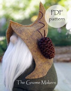 the gnome is wearing a pine cone on his head and has long white hair, while he