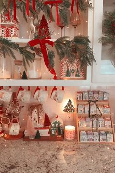 a kitchen counter topped with lots of christmas decorations