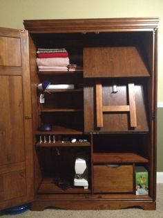 a wooden bookcase with many items in it