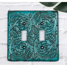 a decorative light switch plate cover with an intricate design