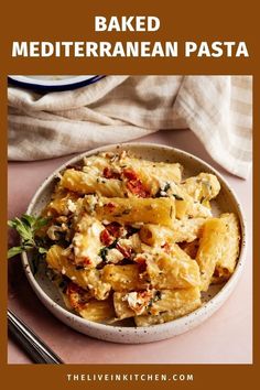 baked mediterranean pasta in a white bowl with text overlay