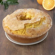 a cake sitting on top of a white plate next to an orange