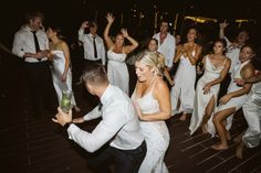 a bride and groom dancing on the dance floor