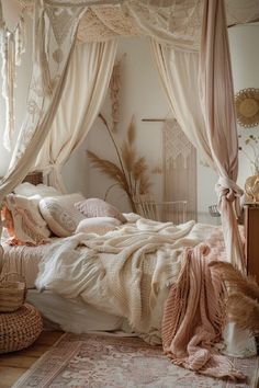 a bedroom with a canopy bed, rugs and pillows on the floor in front of it