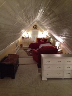 an attic bedroom with two beds, dressers and a bed in it's corner